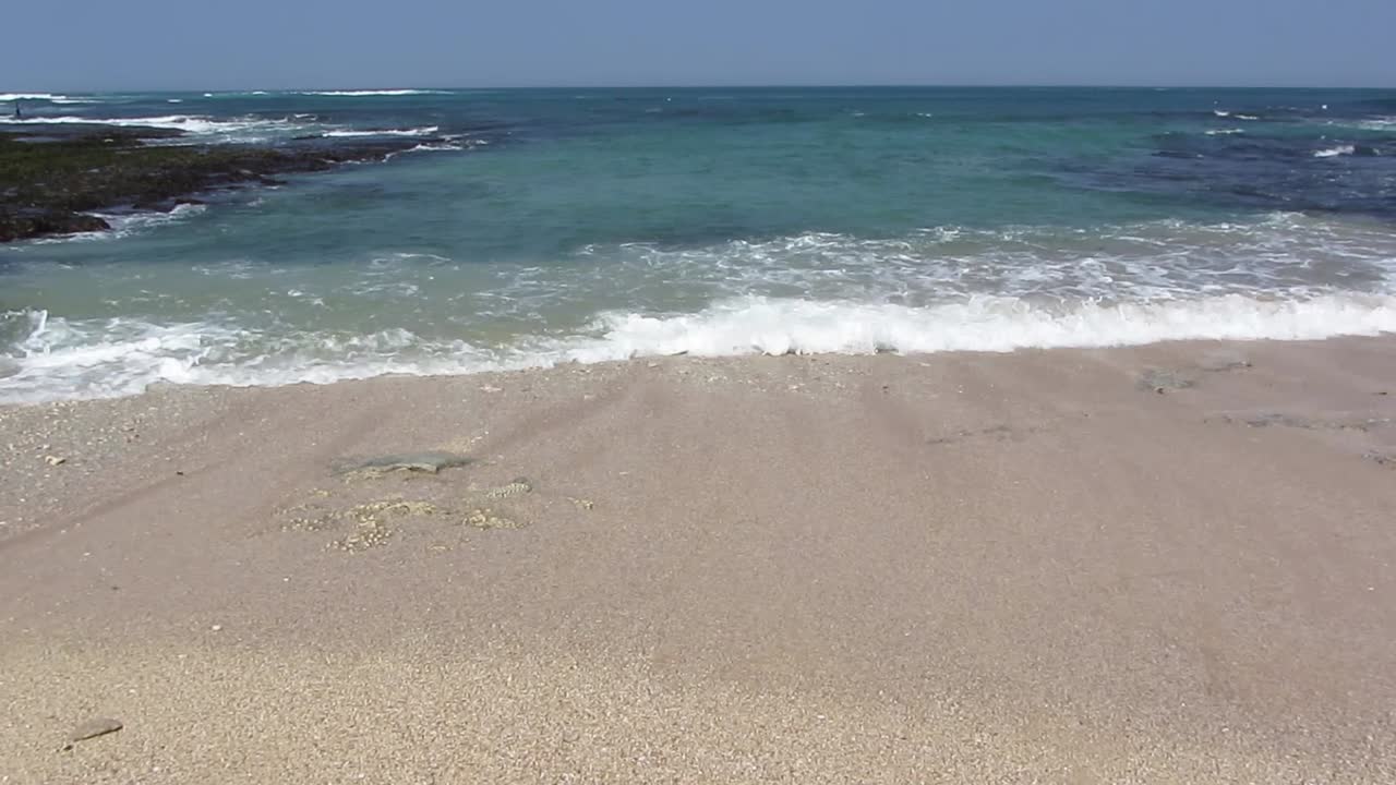 Slowing Waves flowing on beach as nature background