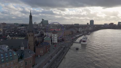 Orbital-View-Altstadt-Old-Town,-Rhine-Riverside-with-Wheel-of-Vision,-Düsseldorf,-Germany