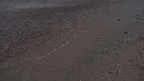 Soft-wave-of-the-sea,-beach-sand-texture