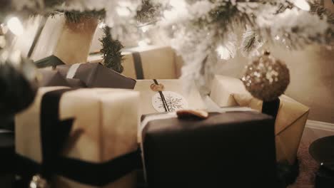 wrapped gifts and presents underneath a decorated christmas tree