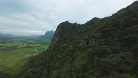 drone high above the expansive valleys and mist-shrouded hills of blue lagoon, laos, with scenic views over the highlands