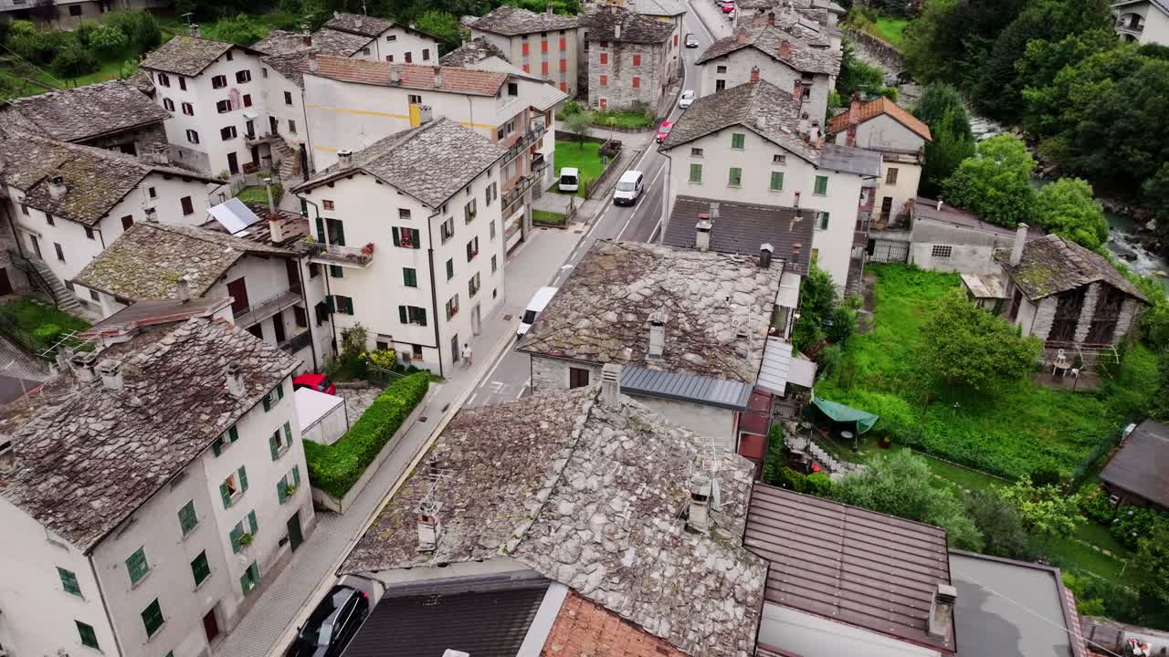Traditional Italian village Borgonuovo, drone among mountains and historic roofs