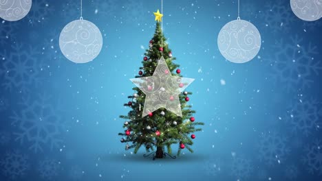 Christmas-decorations-hanging-and-snow-falling-over-christmas-tree-spinning-on-blue-background