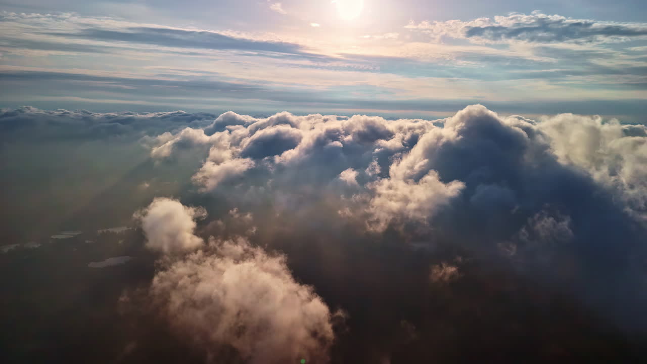 Soaring above beautiful clouds in a tranquil sky captured in stunning aerial footage. Ideal for cinematic scenes, nature visuals, and dreamlike travel content.