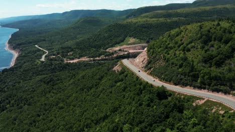 Cars-driving-on-the-coastline-of-the-Cabot-Trail,-Nova-Scotia