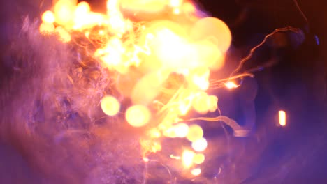 macro-of-steel-wool-getting-burned-from-top-right-on-blue-background