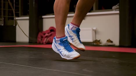 man jumping rope in a gym