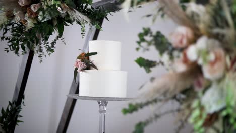 white wedding cake with flowers - selective focus