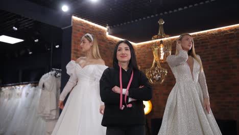 wedding dress shop with designer and models