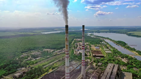 factory with smoke stack. factory pollutes the atmosphere harmful emissions