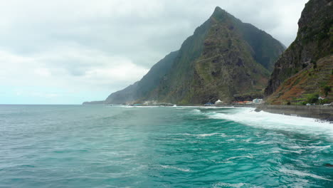 beautiful cloudy mountain coast line landscape madeira with waves panoramic sky ocean, beach drone shot