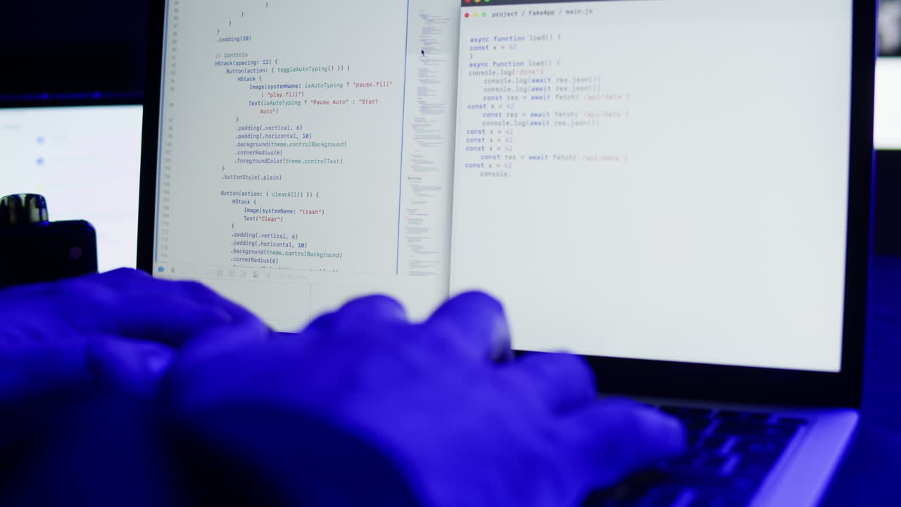 Programmer Hands Typing Code on Laptop Keyboard