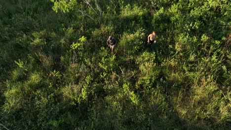 Group-of-people,-mand-and-woman-lost,-exploring-dense-tropical-jungle-and-rainforestin