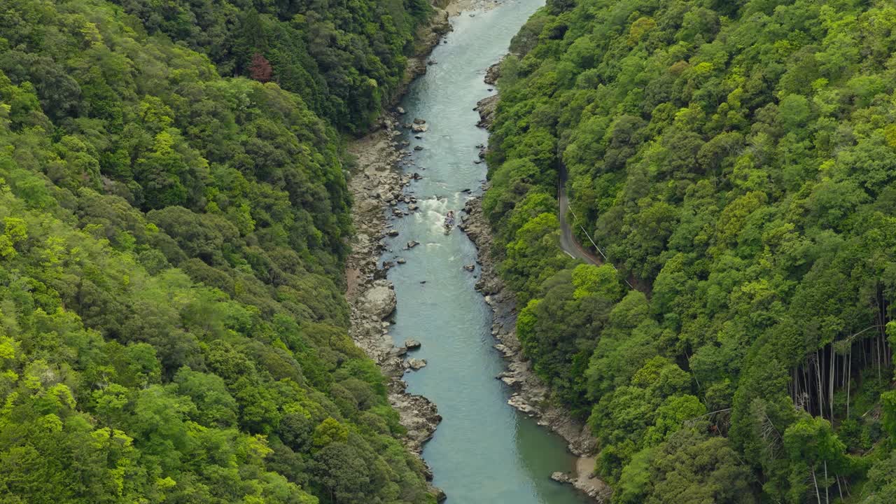 Aerial landscape of Arashima River in Kyoto Japan, Boat ride through forested mountains