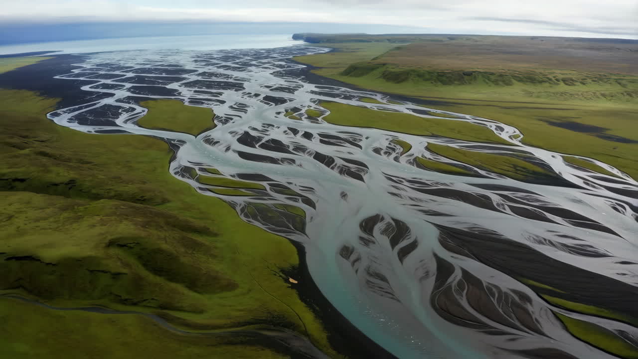 Aerial View of a Braided Glacial River System Flowing to the Ocean
