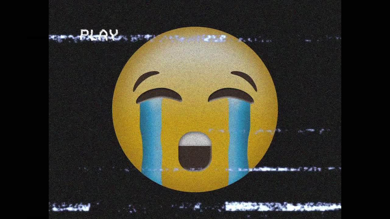 검은 바탕에 화면의 소음 위에 슬픈 이모지 아이콘의 애니메이션