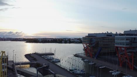 Evening-aerial-rises-over-marina-and-waterfront-buildings-in-Helsinki