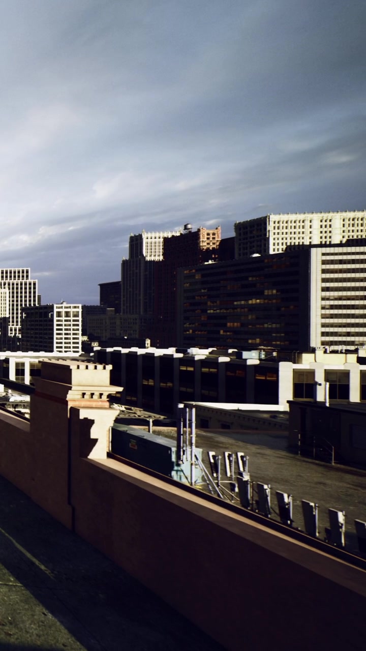 City skyline with buildings under cloudy sky in downtown area