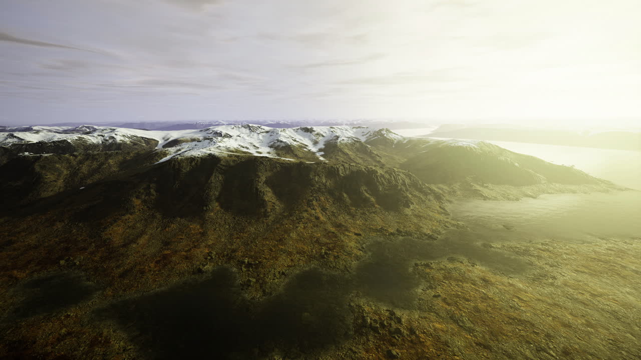 Exploring the majestic snow capped peaks at dawn near a tranquil lake