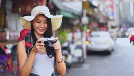 the young chinese traveler take a photo in china town of thailand.