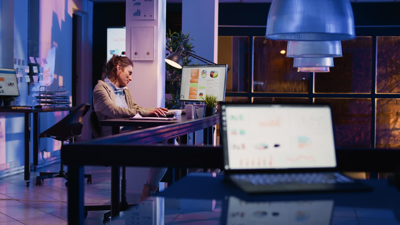 Businesswoman working late at night in the office