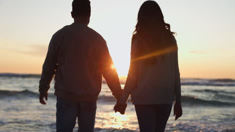 Holding-hands,-sunset-and-couple-walking