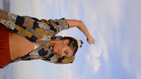 Stylish-woman-dancing-in-countryside