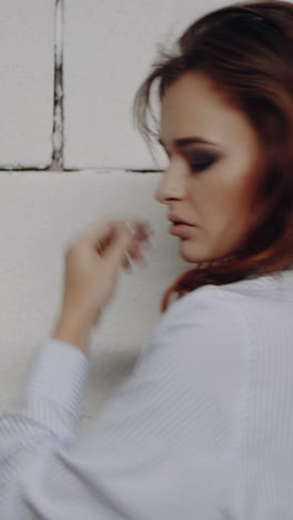 portrait of a young beautiful brunette with a beautiful make up vertical video