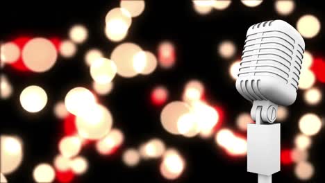 retro white microphone against red and yellow spots of light against black background