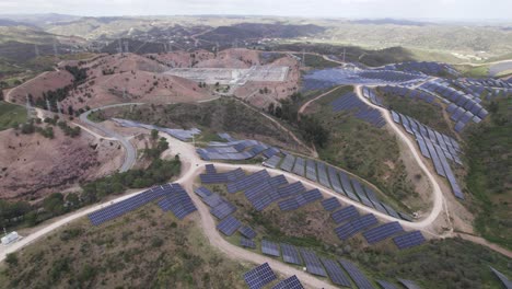 Circling-aerial-view-Photovoltaic-Plant-of-Morgado-de-Arge-in-Portimao,-Portugal