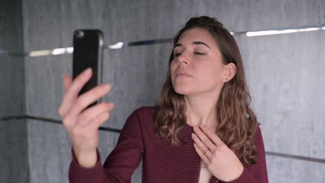 delighted woman with smartphone on cruise ship