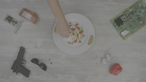 preparing a caesar salad with cyberpunk accessories