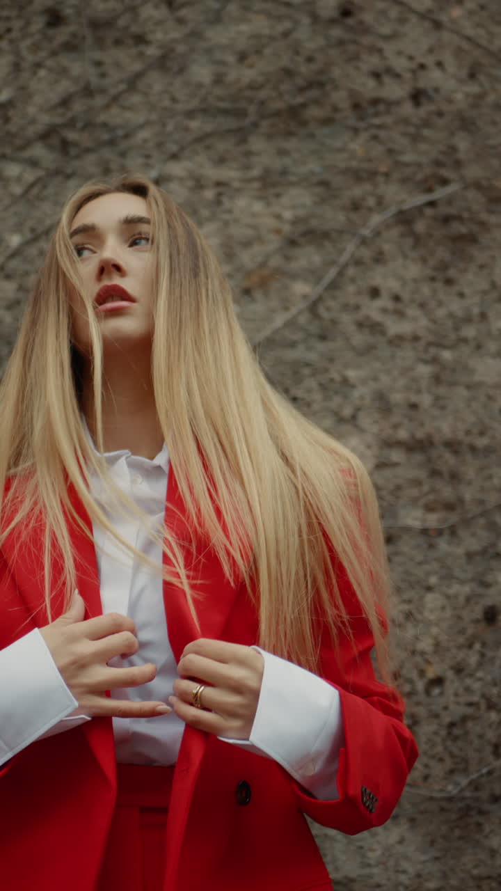 Woman in red blazer and white shirt