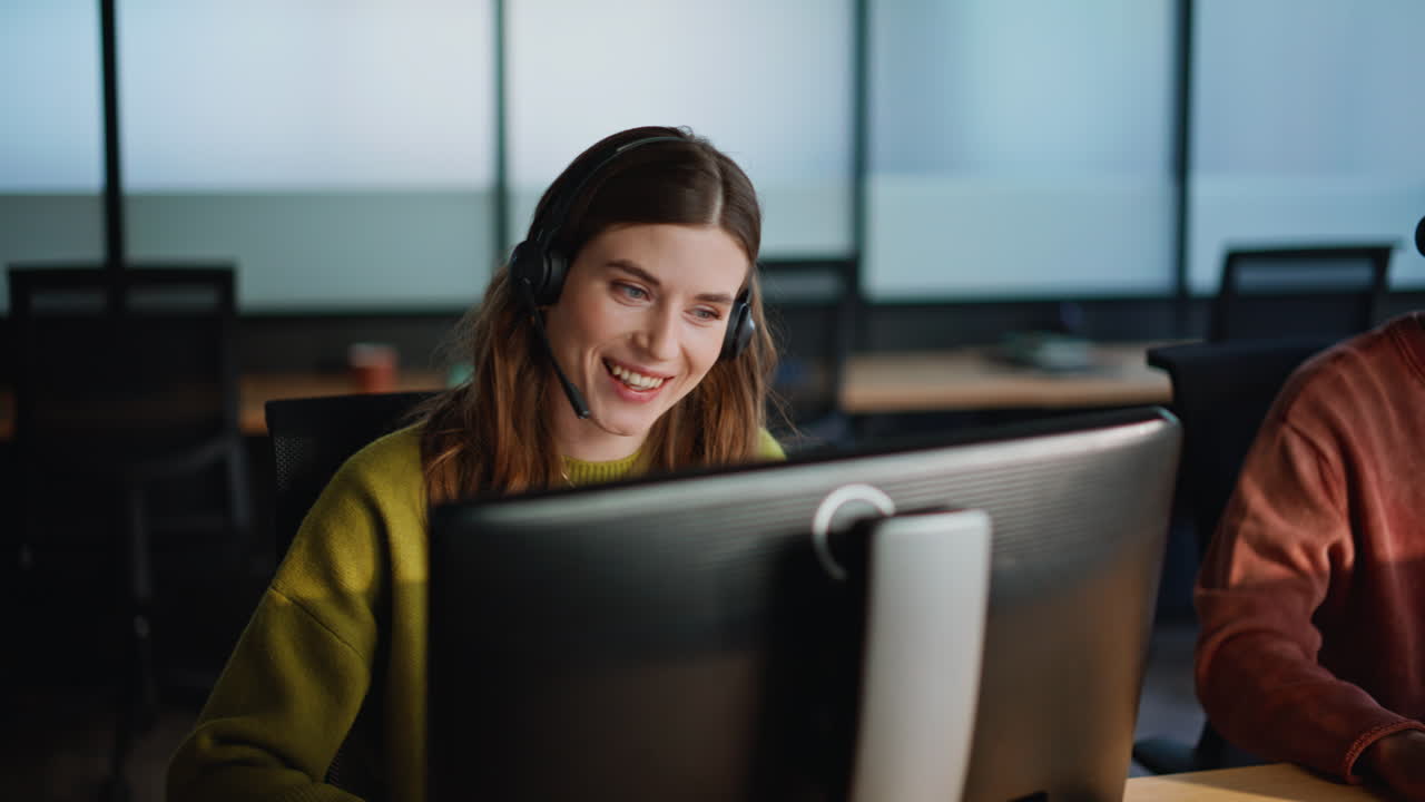 Service desk coworkers consulting clients online at company open space closeup