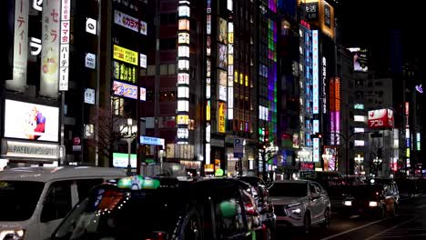 time-lapse of traffic and neon signs at night.