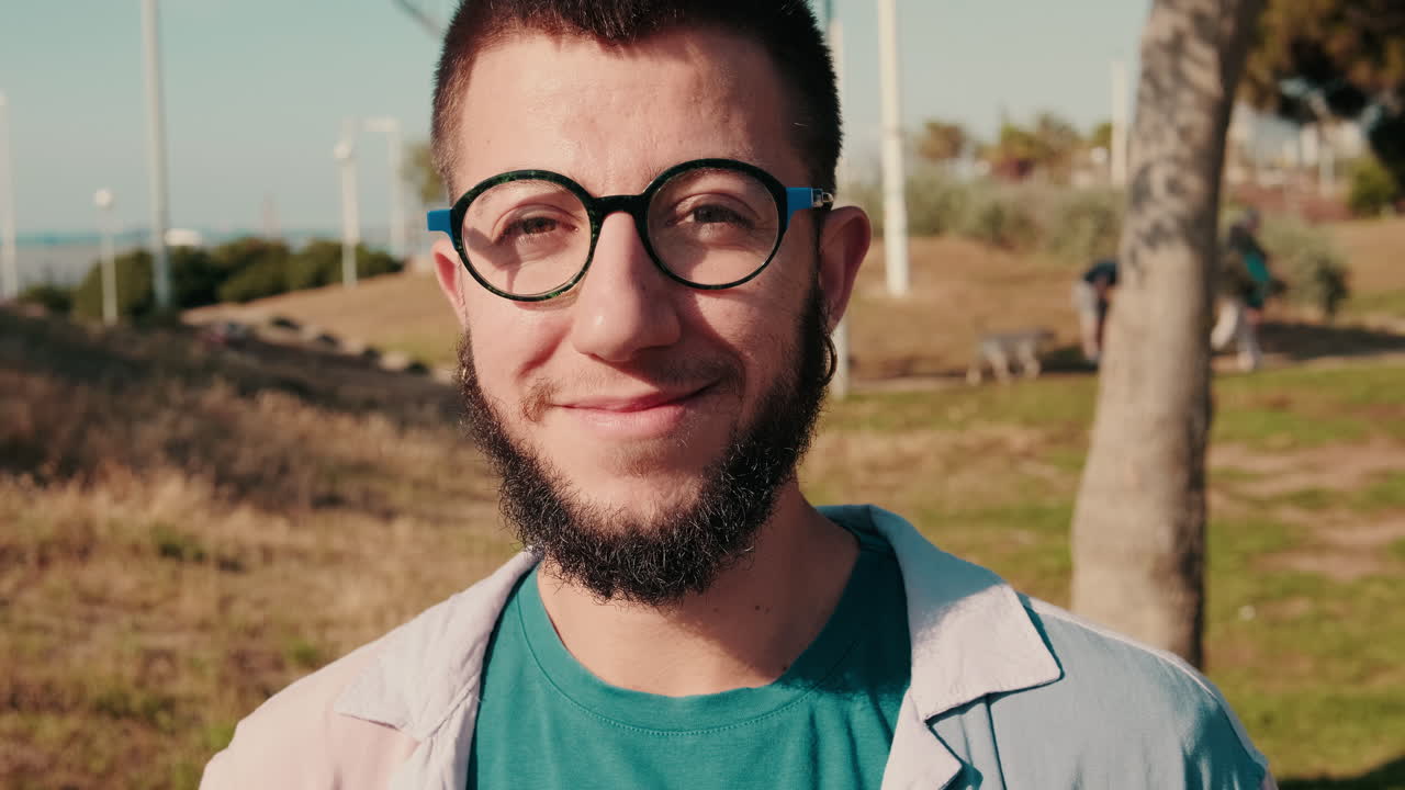 Portrait of a Happy Young Man in the Park