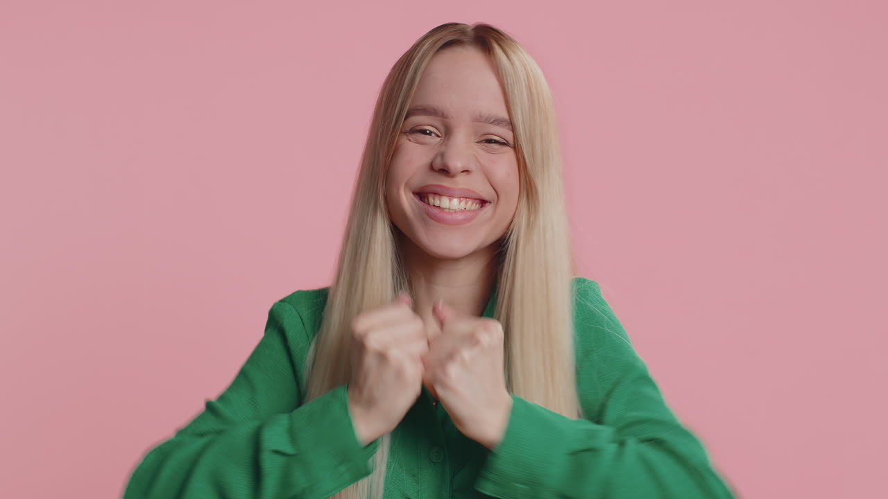 Happy young woman celebrating success winning birthday lottery jackpot goal achievemen good news