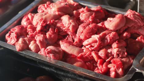 raw variety meat displayed at a market