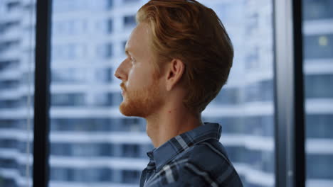 entrepreneur looking at window