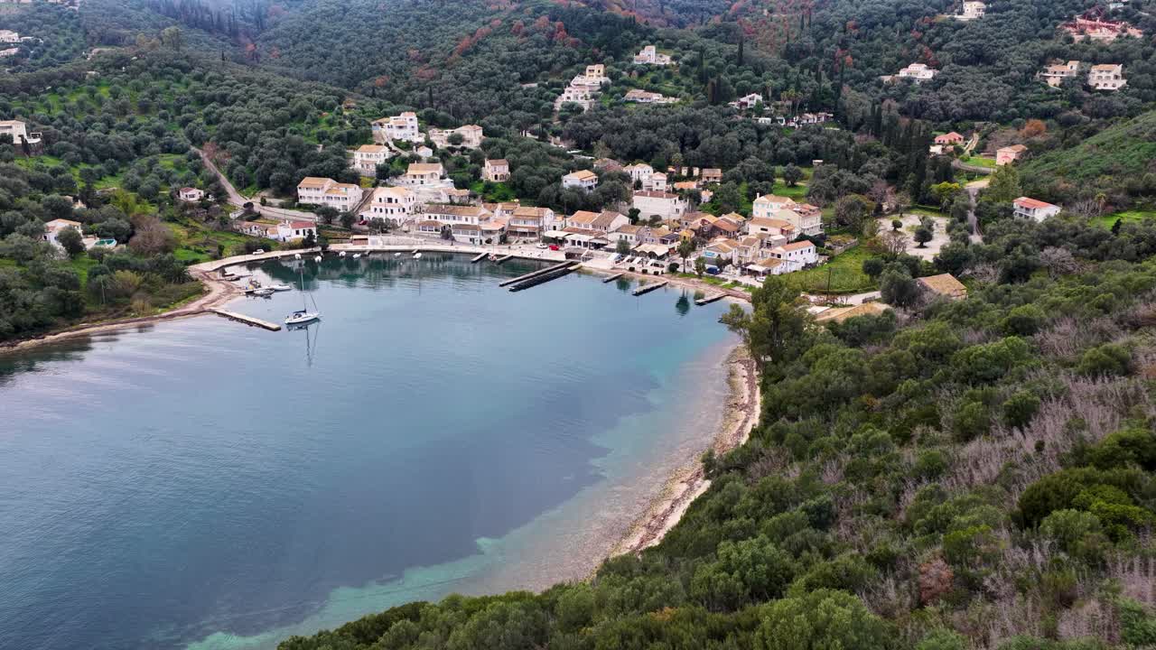 erial view of coastal village and green hills in Corfu island Greece sunny summer day
