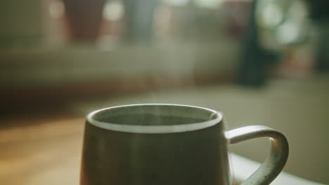 steam rising from a tea mug on a kitchen counter