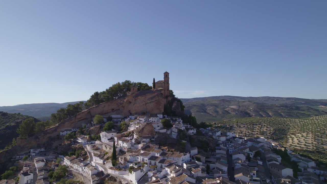 Montefrio. Village Church. Iglesia de la Villa. Church next to cliff. Aerial view of Andalusian town and church on cliff. Montefrio. Andalusia. Spain.