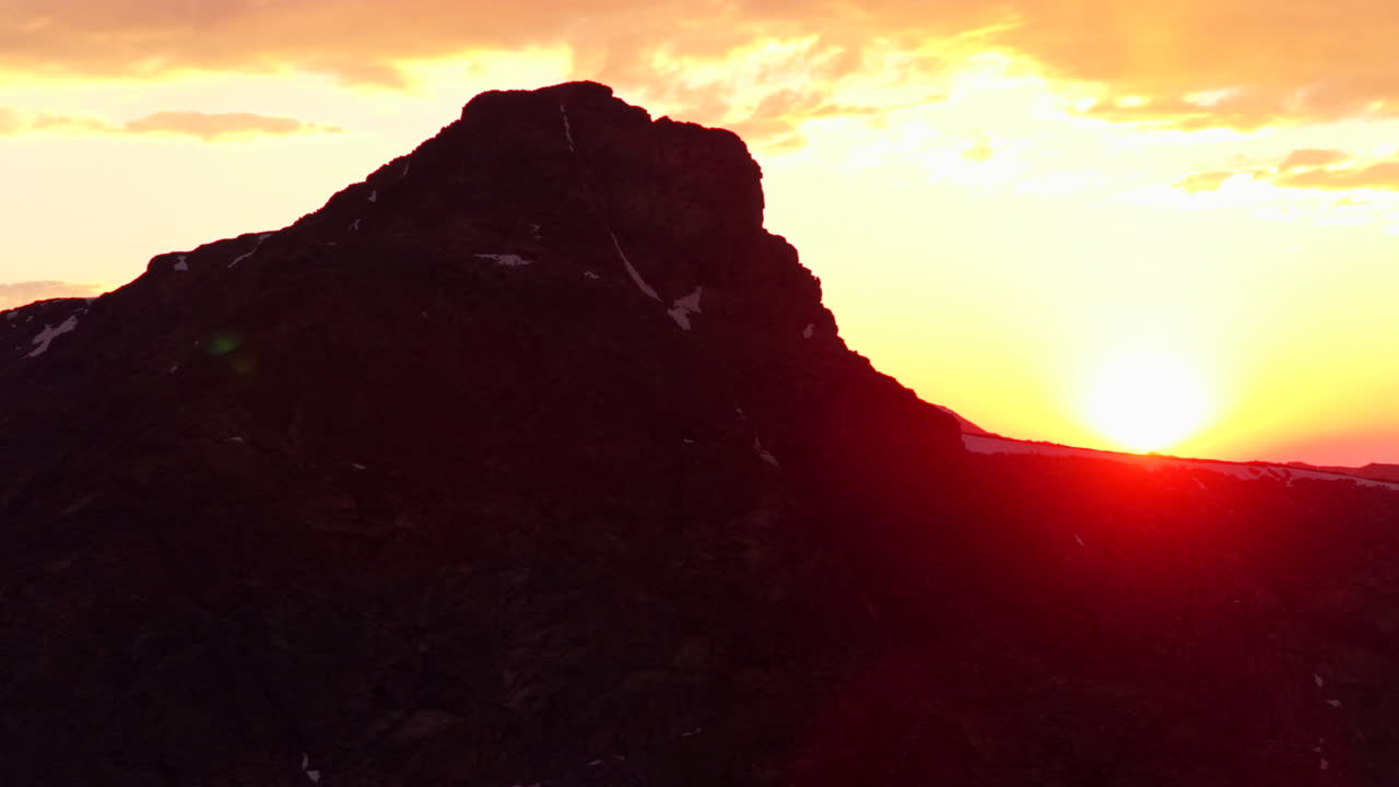 Mount of the Holy Cross Halo Ridge Colorado 14er peak Sawatch Range parallax aerial drone Vail Minturn golden hour vibrant sunset on Rocky Mountains horizon Notch Mountain shelter circle left motion