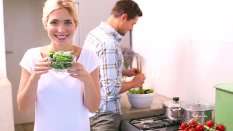 Happy-young-couple-cooking-together