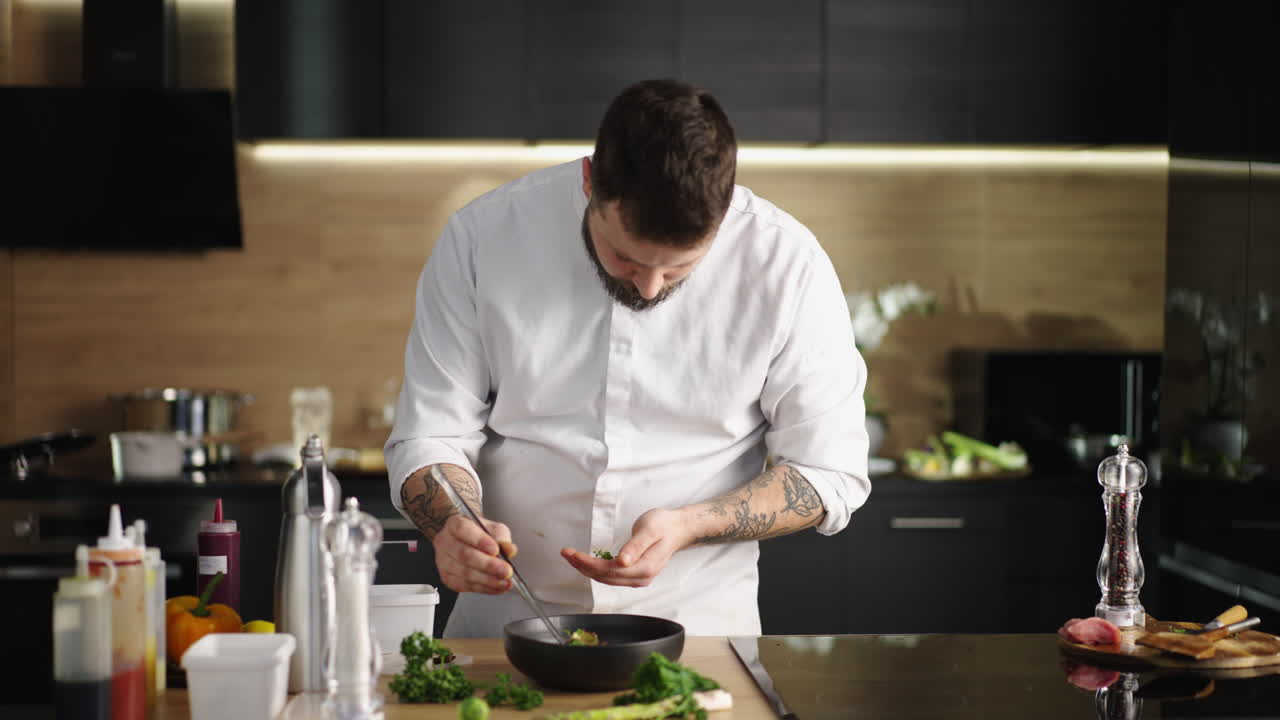 Chef preparing a dish in the kitchen