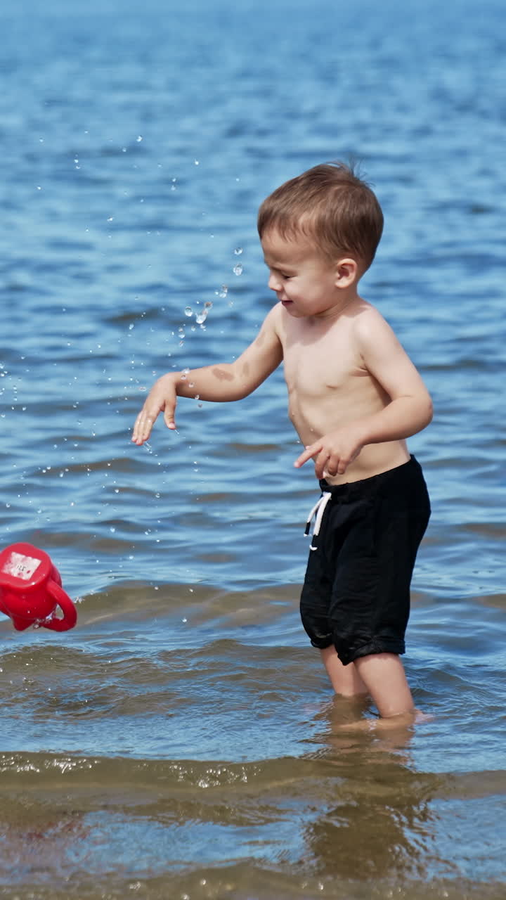 Water summertime lifestyle. Summer child having fun on a river. Vertical video