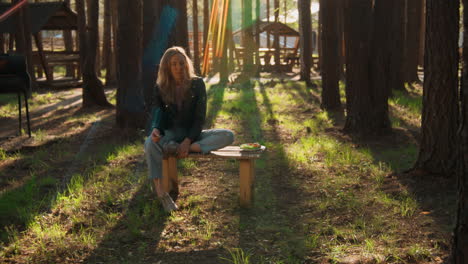 woman relaxing in a forest park