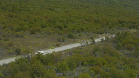 Beautiful-aerial-view-of-a-truck-driving-through-the-jungles-of-Patagonia