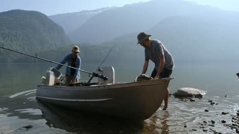 two fishermen preparing for fishing in the river 4k