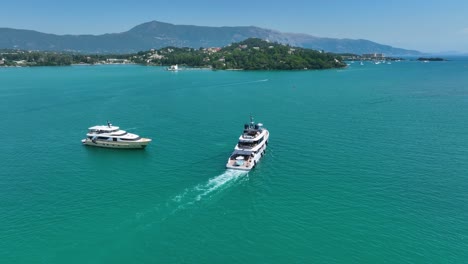 an stunning aerial view capturing two opulent luxury yachts cruising on the crystal-clear turquoise waters of the ionian sea, with a beautiful, lush greek coastline in the background
